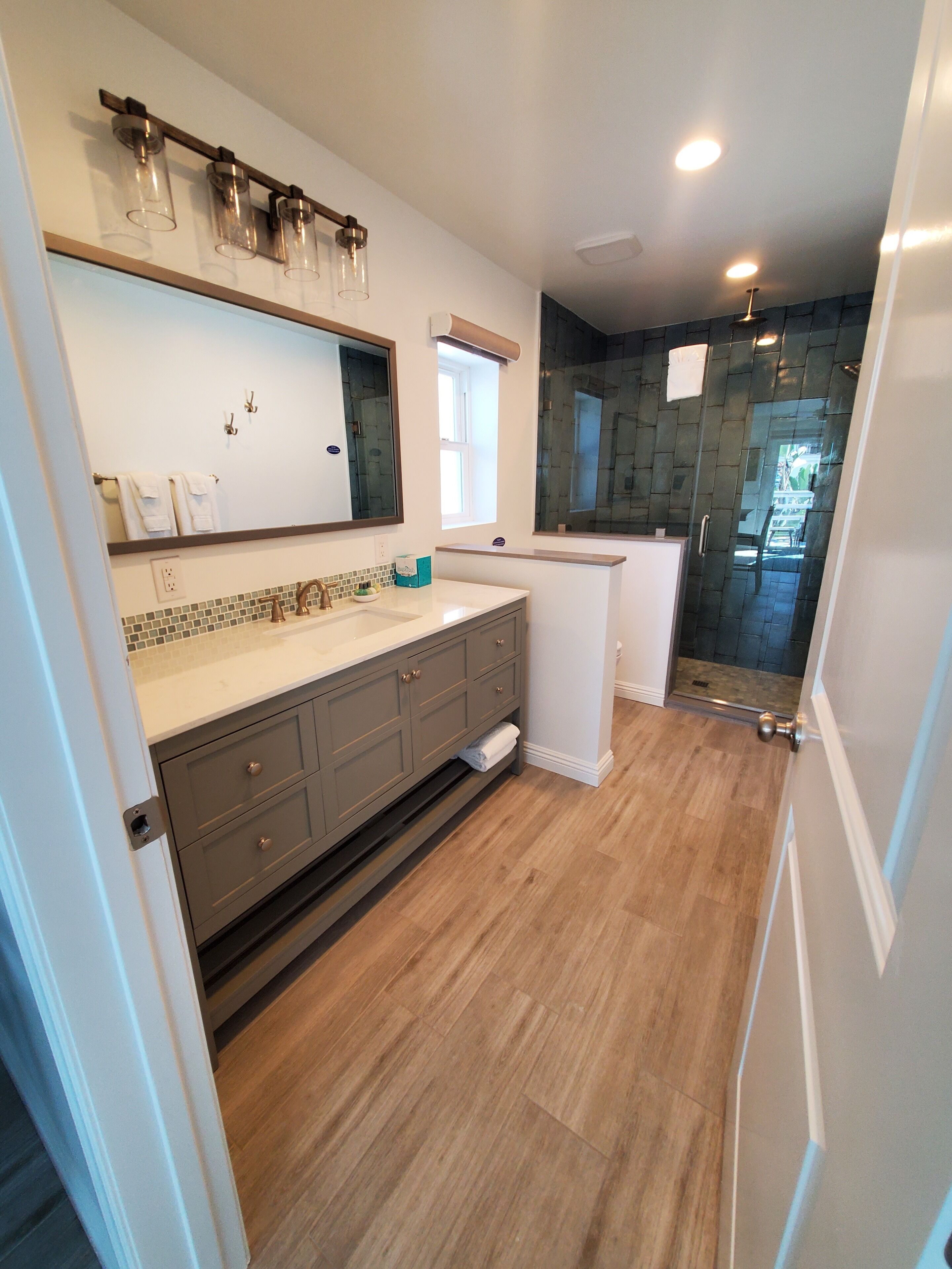 standard suite, 1 king bed, partial ocean view | bathroom | free toiletries, hair dryer, towels, soap