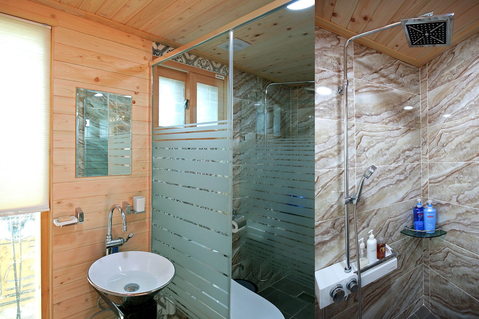 A bathroom with a wooden vanity, a sink, a glass shower enclosure, and a marble shower wall.
