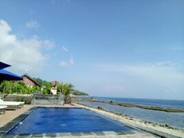 Outdoor pool, open 7:00 AM to 9:30 PM, pool loungers