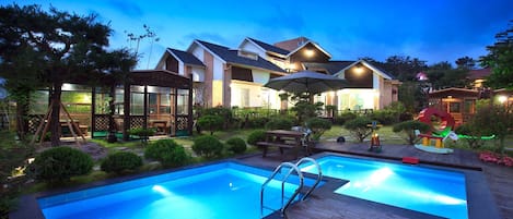 Seasonal outdoor pool, open 11:00 AM to 8:00 PM, pool umbrellas