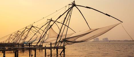 A pier with fishing nets extending into the water.
