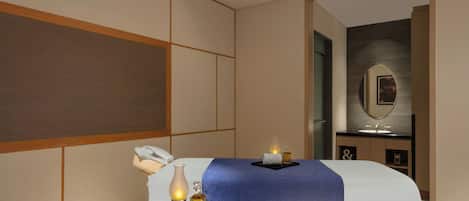 A hotel room with two beds, a bathroom, and a mirror.