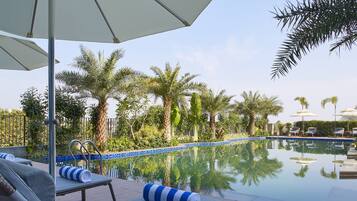 Outdoor pool, open 7:00 AM to 7:00 PM, pool umbrellas, sun loungers