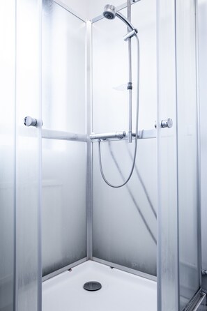 Apartment, 2 Bedrooms | Bathroom | Shower, free toiletries, hair dryer, towels