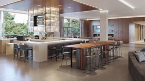 A modern kitchen with a central island, bar stools, and a wine rack. - AC Hotel by Marriott San Jose Santa Clara (Santa Clara)