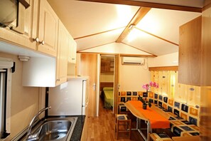 Mobile Home, 2 Bedrooms | Private kitchen | Full-size fridge, stovetop, coffee/tea maker, highchair