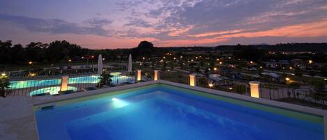 Outdoor pool, pool umbrellas, sun loungers