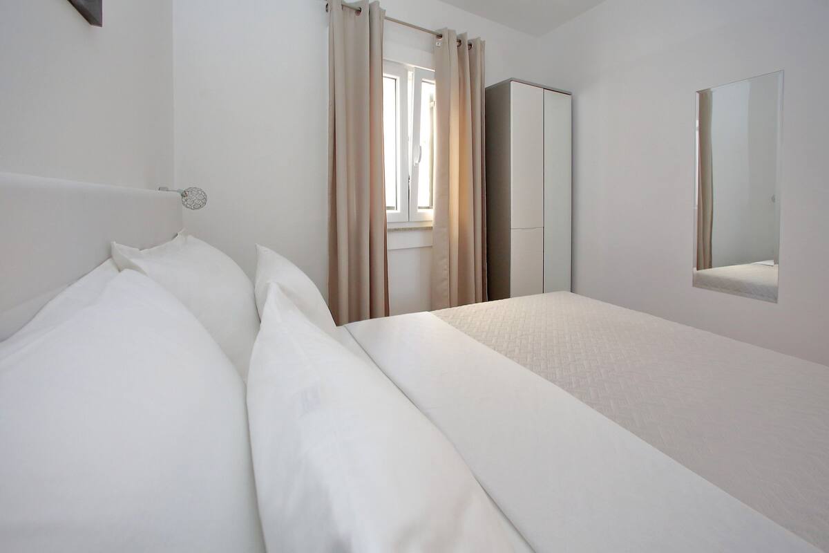 Apartment, 1 Bedroom, Sea View | 1 bedroom, iron/ironing board, free WiFi, bed sheets