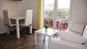 Apartment, 1 Bedroom | Living area | Flat-screen TV