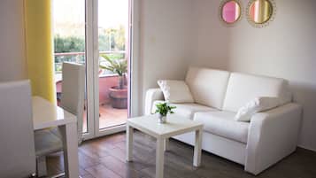 Apartment, 1 Bedroom | Living area | Flat-screen TV