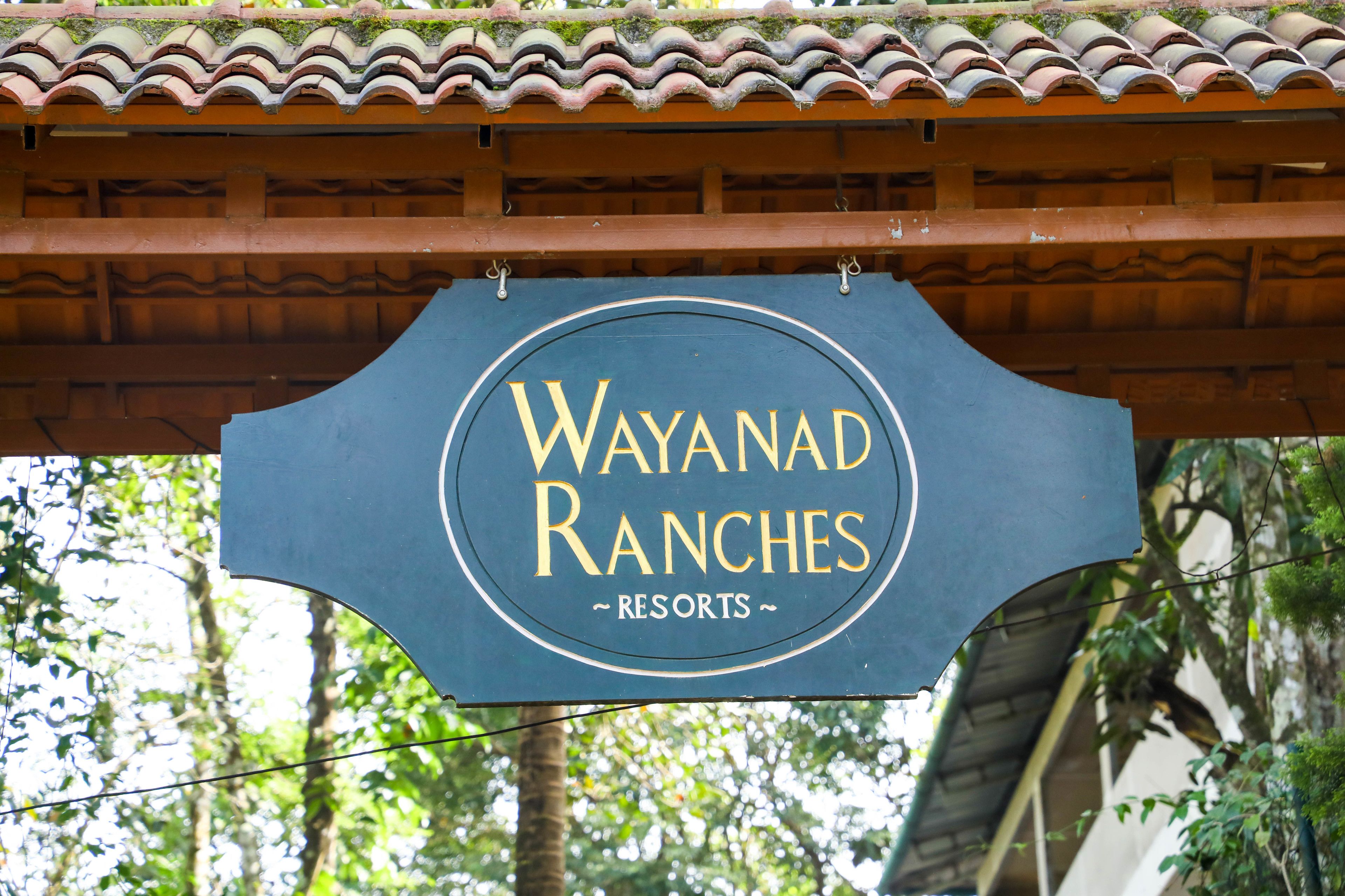 A sign for Wayanad Ranches Resorts.