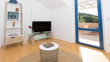 Villa, Pool Access | Living area | 108-cm flat-screen TV with satellite channels, TV