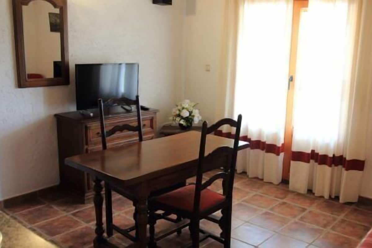 Apartment, 1 Bedroom, Balcony, River View | Living room | Flat-screen TV