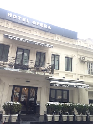 A building with the sign "HOTEL OPERA" prominently displayed. - Hotel Opera (Tbilisi)