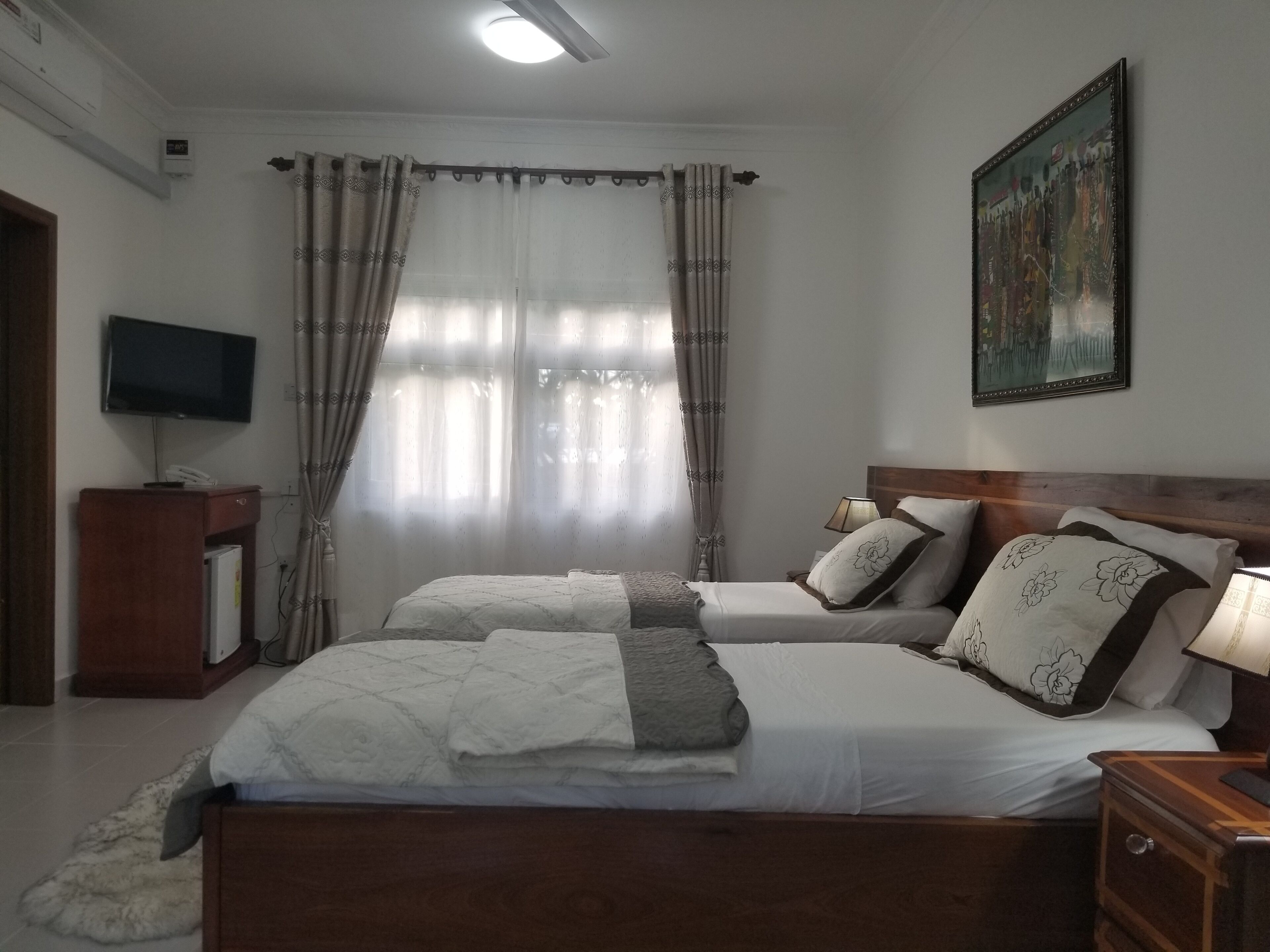 luxury double room, 2 single beds, garden view | 1 bedroom, premium bedding, desk, laptop workspace