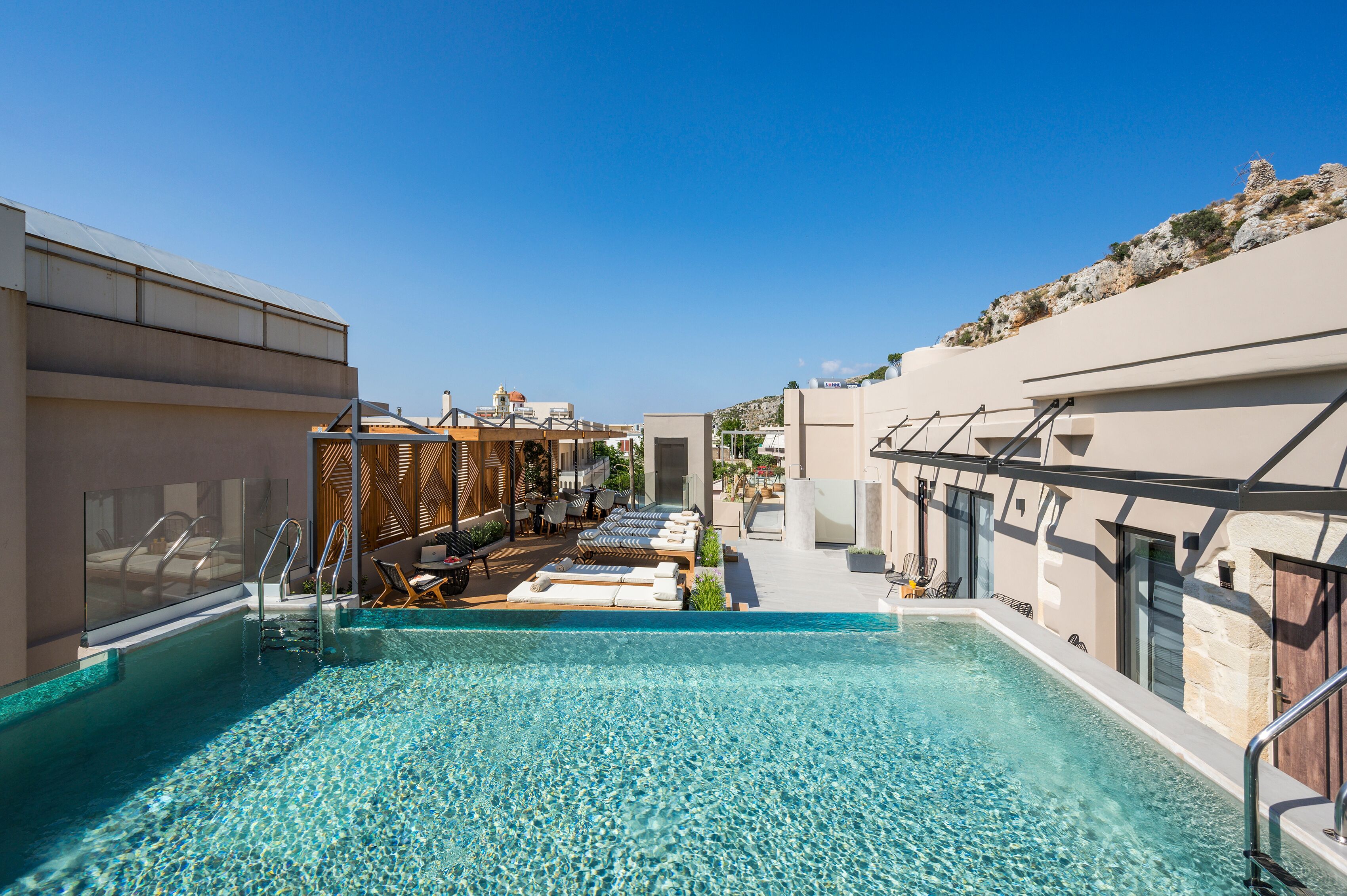 Outdoor pool, open 10:00 AM to 9:00 PM, pool umbrellas, sun loungers