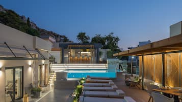 Outdoor pool, open 10:00 AM to 9:00 PM, pool umbrellas, pool loungers