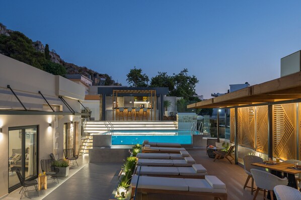 Outdoor pool, open 10:00 AM to 9:00 PM, pool umbrellas, sun loungers