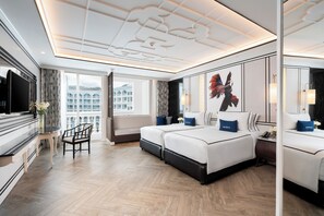 Deluxe Room, 2 Single Beds, Pool View | Minibar, in-room safe, desk, laptop workspace - Mövenpick Myth Hotel Patong Phuket (Patong)
