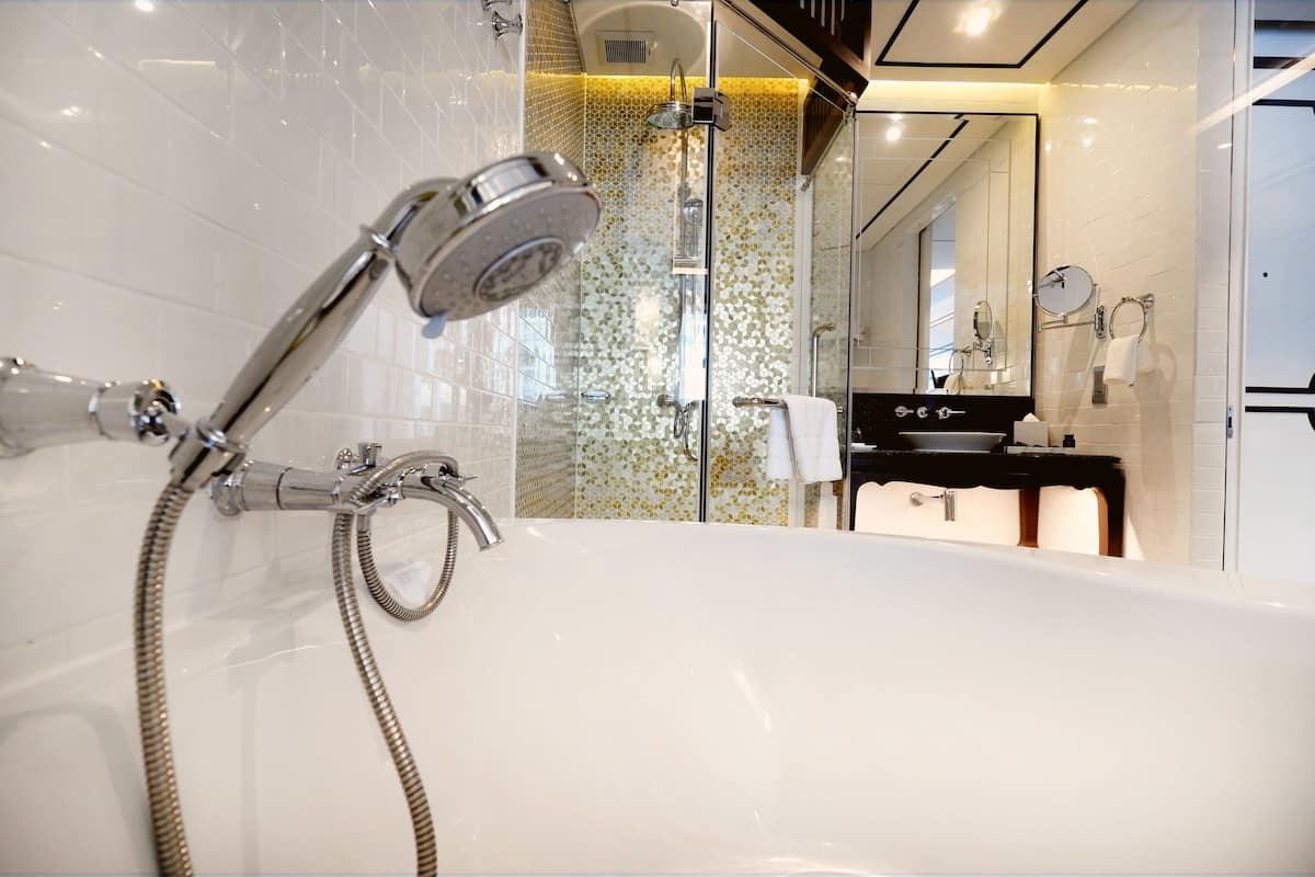 separate bathtub and shower, deep-soaking bathtub, rainfall showerhead