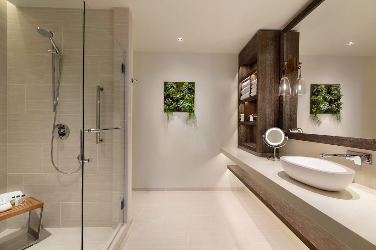 designer toiletries, hair dryer, bathrobes, slippers