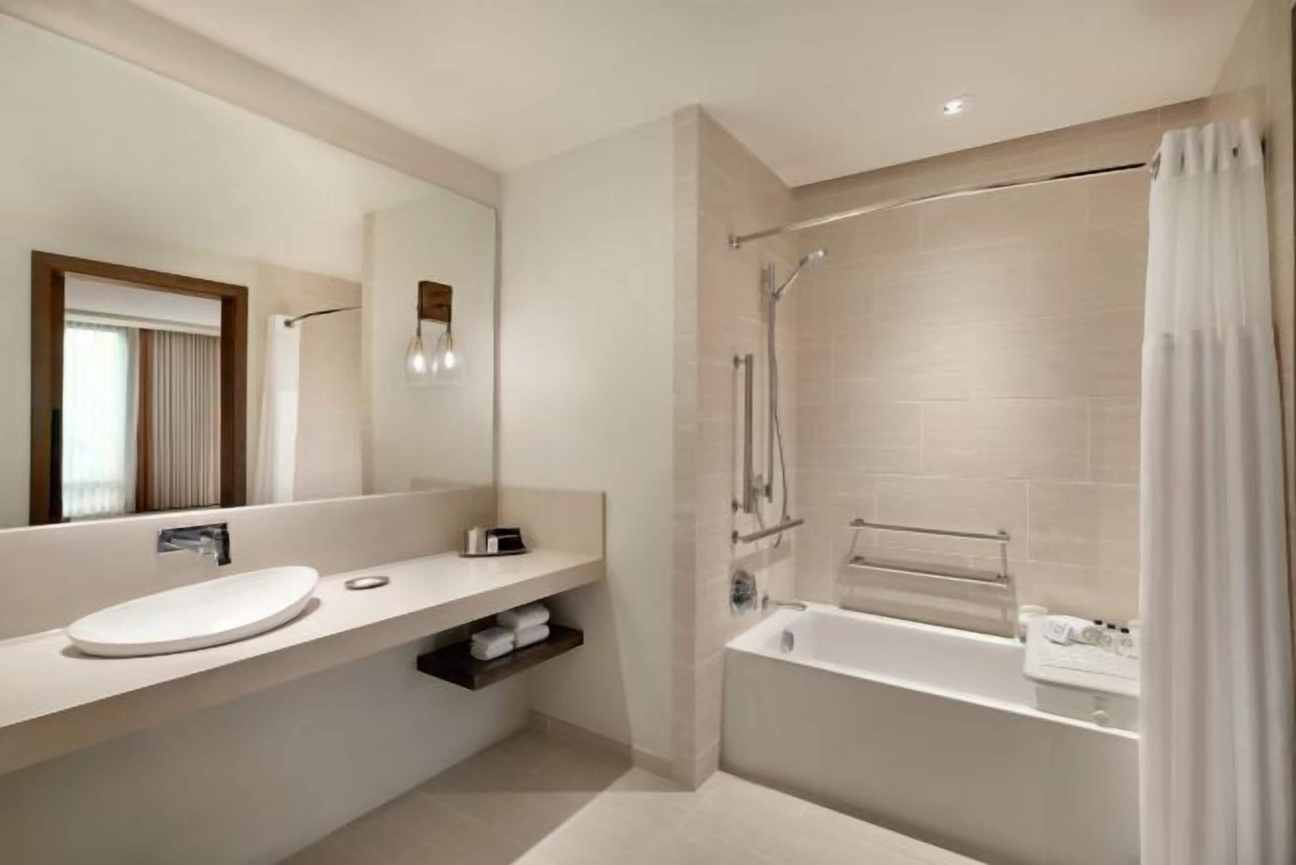 Designer toiletries, hair dryer, bathrobes, slippers