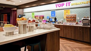 A breakfast area with a sign reading "TOP IT BREAKFAST" and various food items displayed. - Tru by Hilton Wytheville (Wytheville)