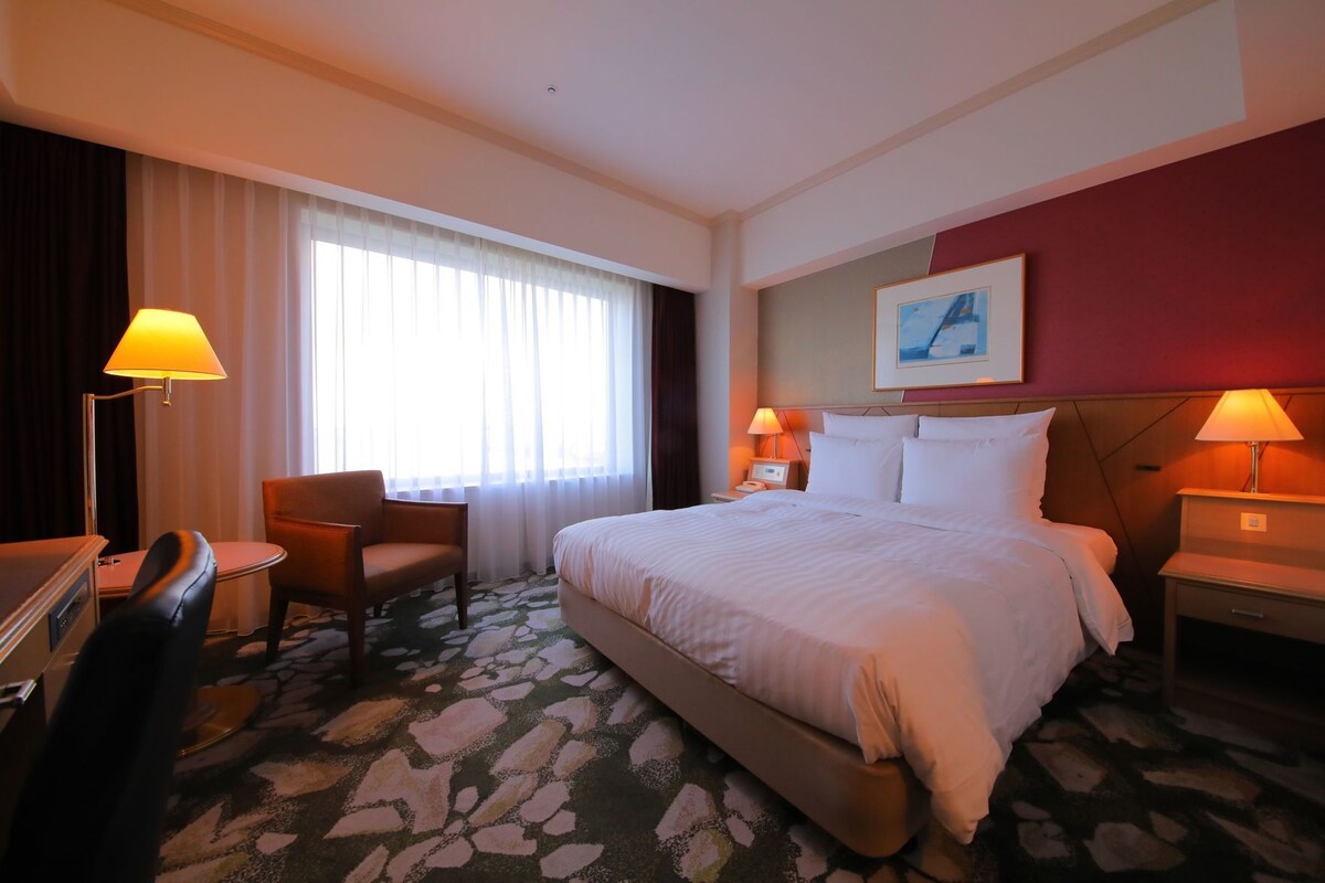 Luxe beddengoed, een kluis op de kamer, een bureau, gratis wifi