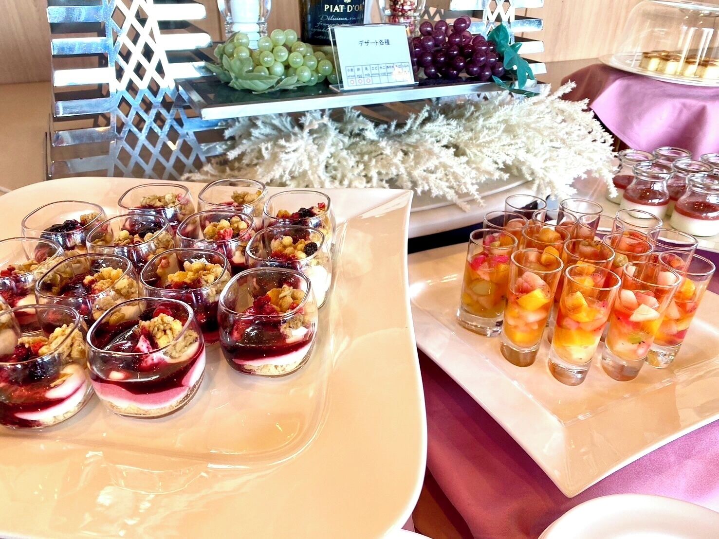A buffet with various desserts and beverages.