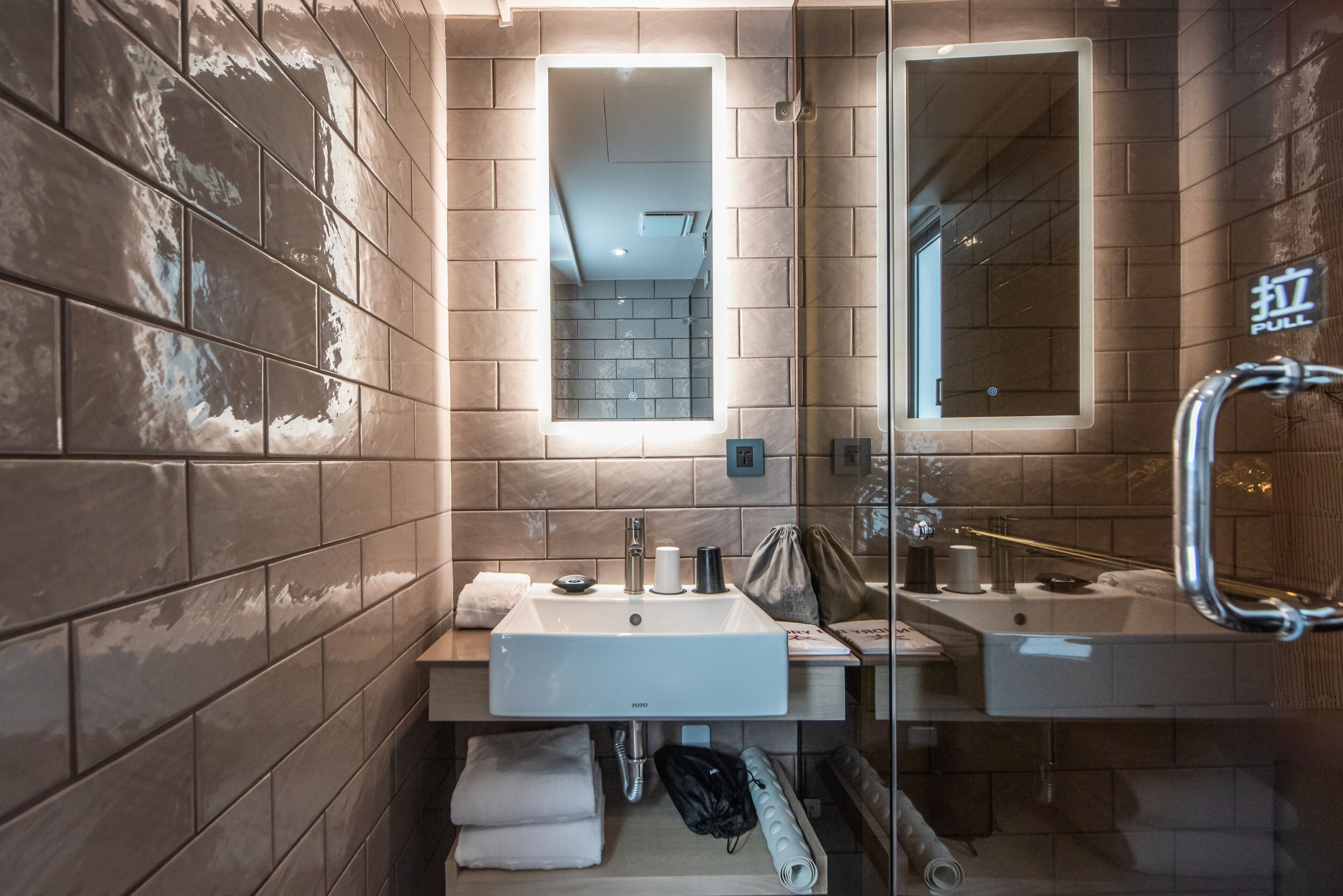 deluxe double room (no bathtub) | bathroom | hydromassage showerhead, hair dryer, slippers, towels