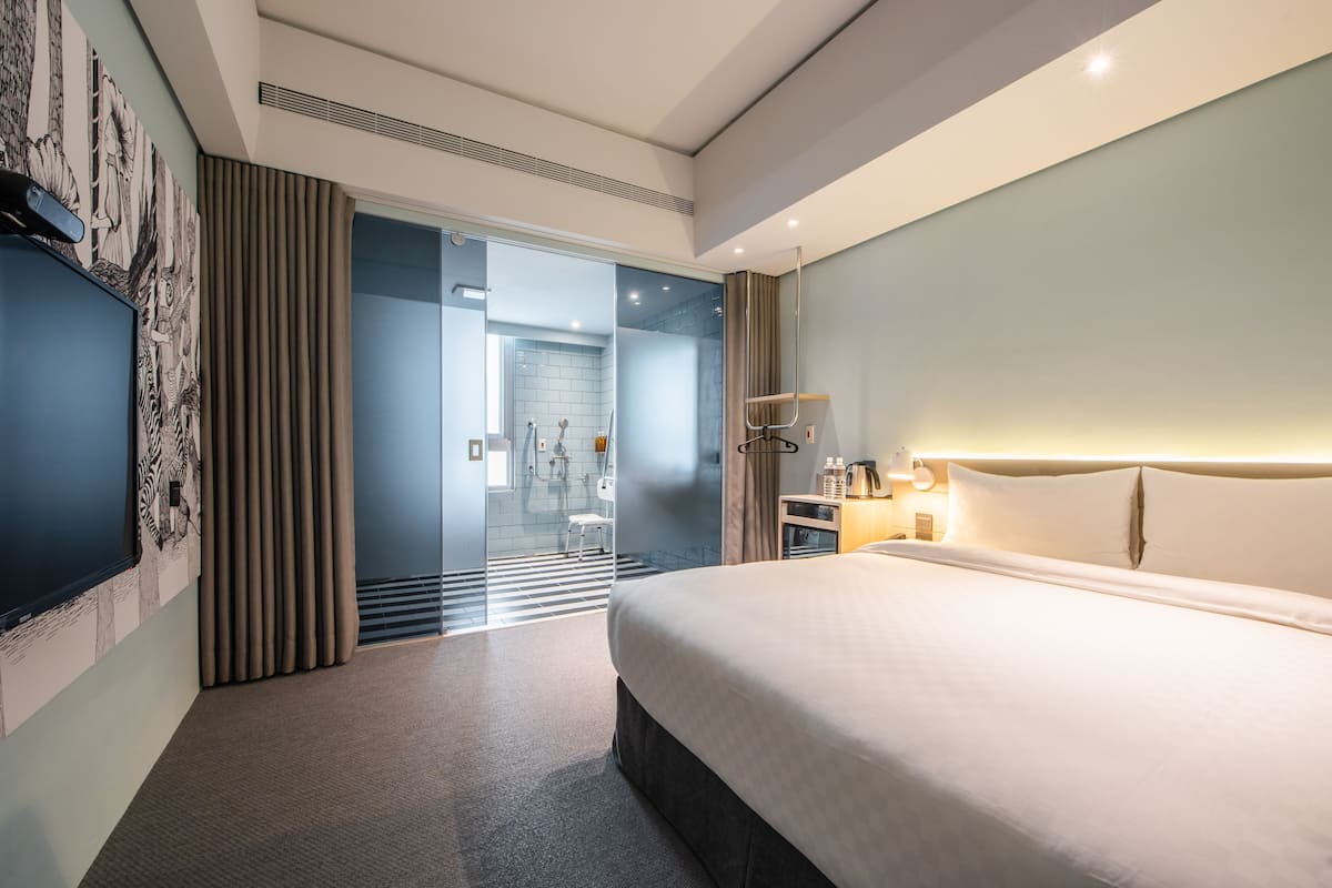 basic double room | down duvets, desk, laptop workspace, blackout curtains