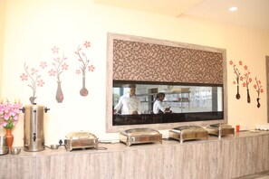 Welcome to our reception area, featuring a modern design with a flat-screen TV and decorative panel.