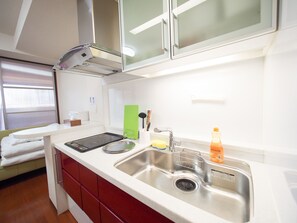 Apartment | Private kitchenette | Fridge, microwave, stovetop, electric kettle - Family Stay DOTONBORI I PH99 (Osaka)