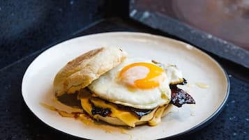 A breakfast sandwich on a plate.