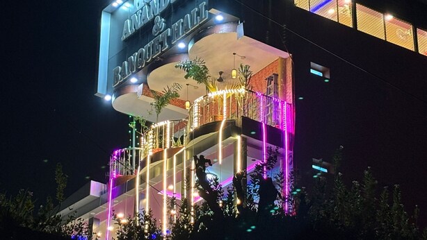 A hotel with a prominent sign reading "HOTEL ANANDLOK BANQUET & HALL". - Hotel Anand Lok (Rajgir)