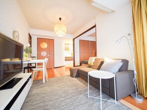 Apartment | Living room | Flat-screen TV - Family Stay DOTONBORI II PH14 (Osaka)