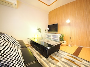 Apartment | Living room | Flat-screen TV - Family Stay DOTONBORI II PH15 (Osaka)