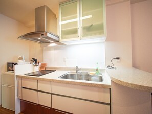 Apartment | Private kitchenette | Fridge, microwave, stovetop, dishwasher - Family Stay DOTONBORI III PH25 (Osaka)