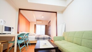 Apartment | Living area | Flat-screen TV - Family Stay DOTONBORI III PH26 (Osaka)