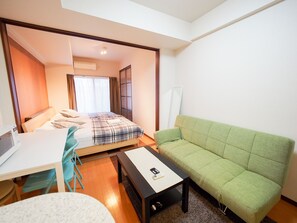Apartment | Living area | Flat-screen TV - Family Stay DOTONBORI III PH26 (Osaka)