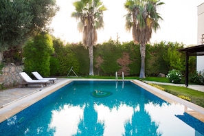 Outdoor pool, pool umbrellas, pool loungers