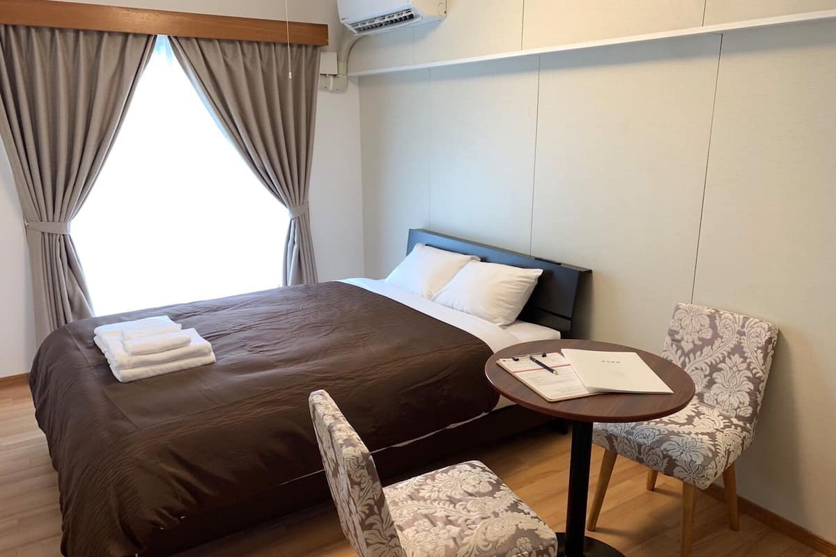 Standard Double Room | Living area | Flat-screen TV