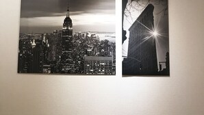 Two black and white photographs of cityscapes, one featuring a prominent skyscraper and the other a building with a sunburst effect. - Tokyo Urban Flat Hotel 201 (Tokyo)