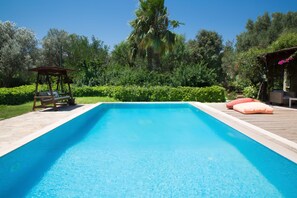 Seasonal outdoor pool, pool loungers