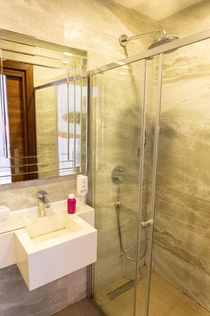Shower, free toiletries, hair dryer, slippers