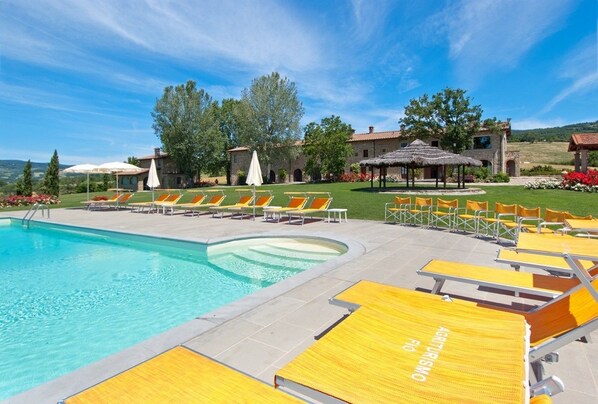 Seasonal outdoor pool, open 8:30 AM to 7:30 PM, pool umbrellas