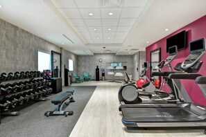 A gym with treadmills, weights, and exercise balls. - Home2 Suites by Hilton Jacksonville-South/St. Johns Town Ctr (Jacksonville)