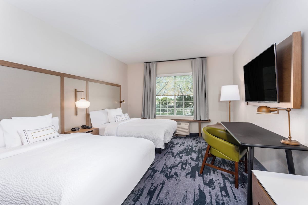 Room, 2 Queen Beds | Desk, blackout drapes, iron/ironing board, free cribs/infant beds