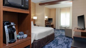 A hotel room with a bed, a desk, a television, a coffee machine, and a microwave. - Fairfield Inn & Suites by Marriott Augusta Washington Rd./I-20 (Augusta)