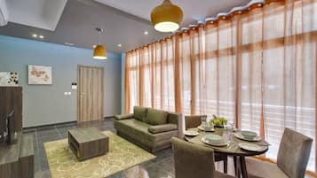 Apartment (1 Bedroom) | Living area | TV